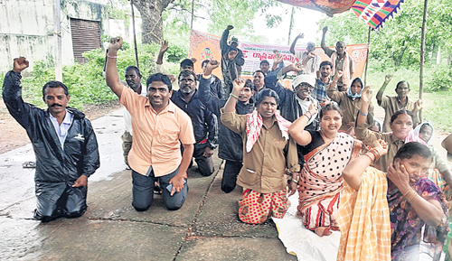 GP workers strike in rain 